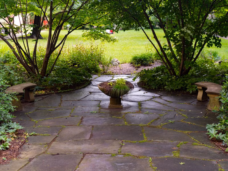 Stone garden patio illustrating paver cleaning services (stock photo)